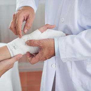 Doctor treating a pain and suffering burn injury