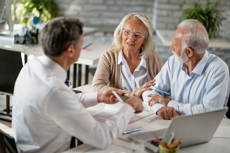 Senior couple communicating with attorney about estate planning
