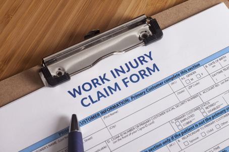 Claim form for a work injury on a desk top